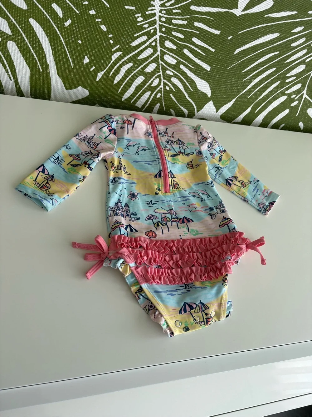 RuffleButts Pink-Trim Pastel Beach Print Rashguard Onesie⛱️